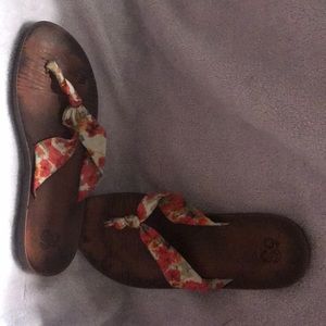 Cute flip flops with floral fabric.